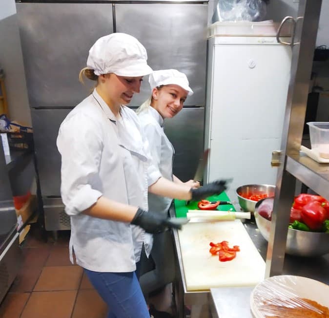 Cooks preparing tasty meal